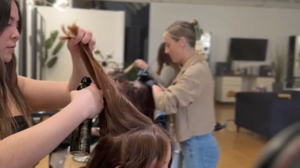 Stylists working with guests inside Jayden Presleigh, The Salon in Carlsbad Village
