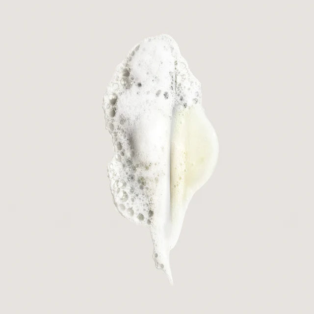 Foamy dollop of Oribe Eternal Curls Moisturizing Shampoo for curly hair.