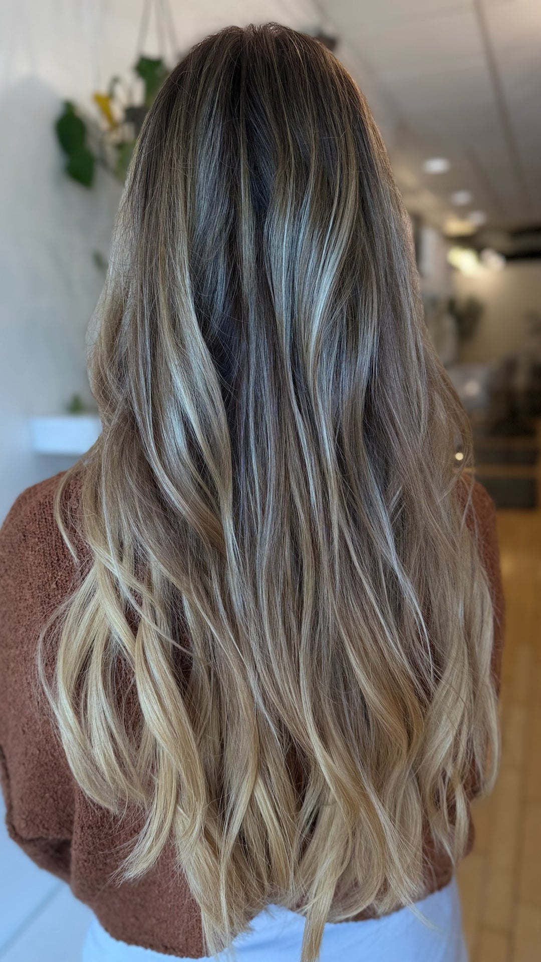 Tape-in hair extensions seamless blend dimensional at Jayden Presleigh The Salon Carlsbad CA