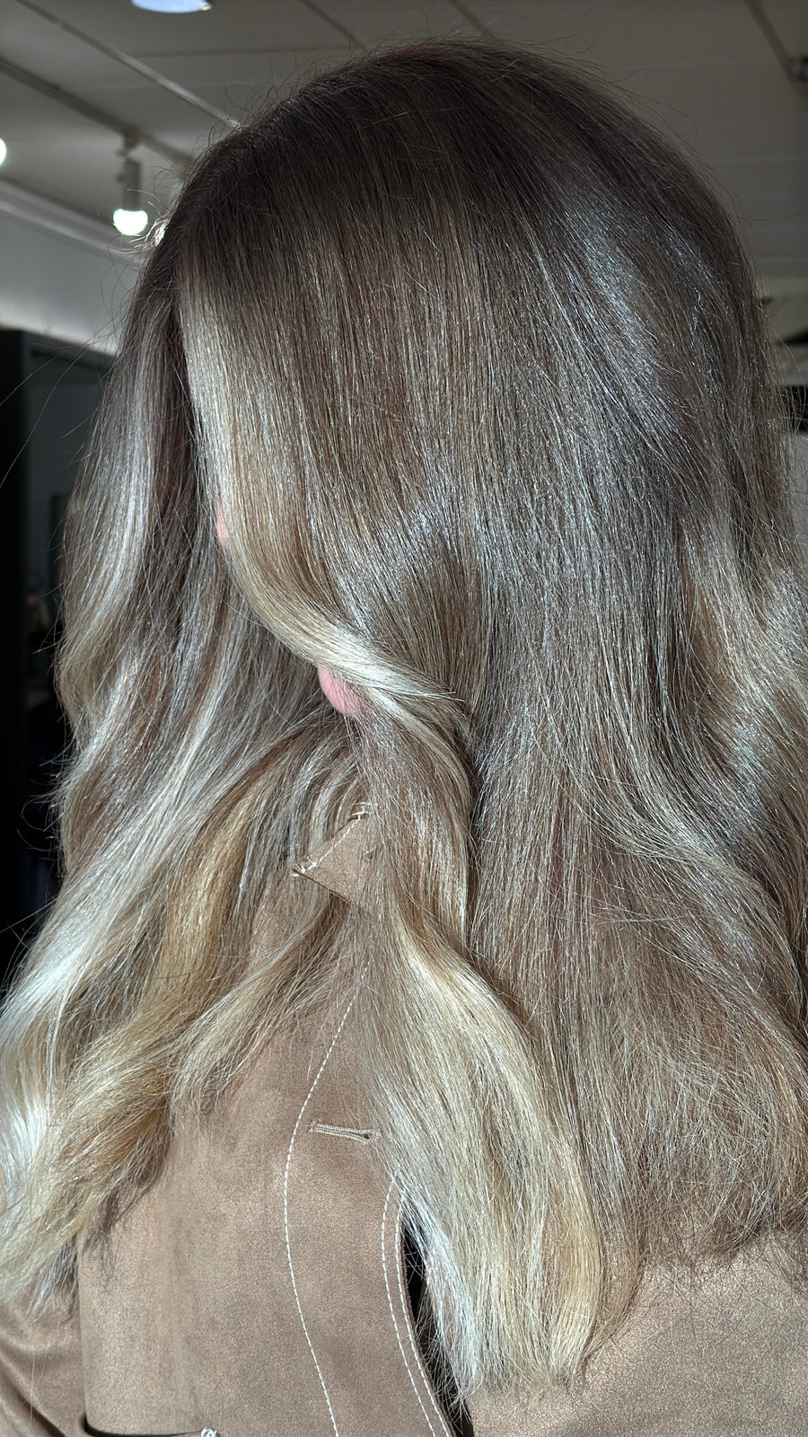 Dimensional blonde balayage with soft waves at Jayden Presleigh hair salon in Carlsbad CA