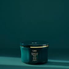 Eternal Curls Deep Treatment Mask teal jar with coconut and almond oils for ultra-moisture and repair.