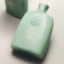 Eternal Curls Cleansing Creme bottle in mint green, lather-free conditioner with nourishing oils and citrus extracts.