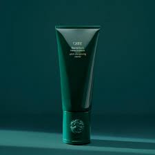 Eternal Curls Intense Conditioner tube in teal packaging on teal backdrop, deep moisture for curly, coily, thick hair.