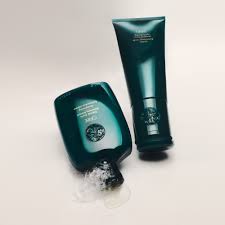 Eternal Curls Intense Conditioner bottles on beige background for ultra-moisturizing, detangling curly and coily hair.